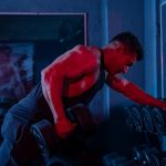 A man working out with a barbell in a gym
